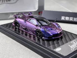 Purple diecast sports car model with black accents on display base