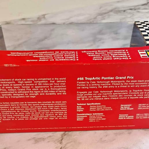 Revell #66 TropArtic Pontiac Grand Prix diecast race car box back, red with tech text panel