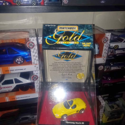 Matchbox Gold diecast blister pack with yellow Mustang Mach III toy car