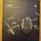 Dual camera drone box with illustrated quadcopter and SD card icon