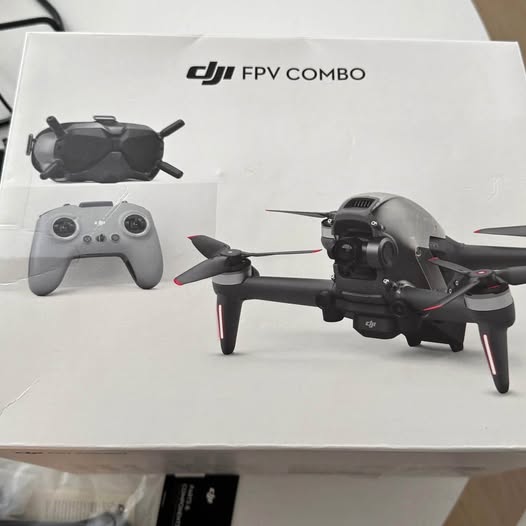 DJI FPV drone kit with black quadcopter and gray controller, showing front and controls.