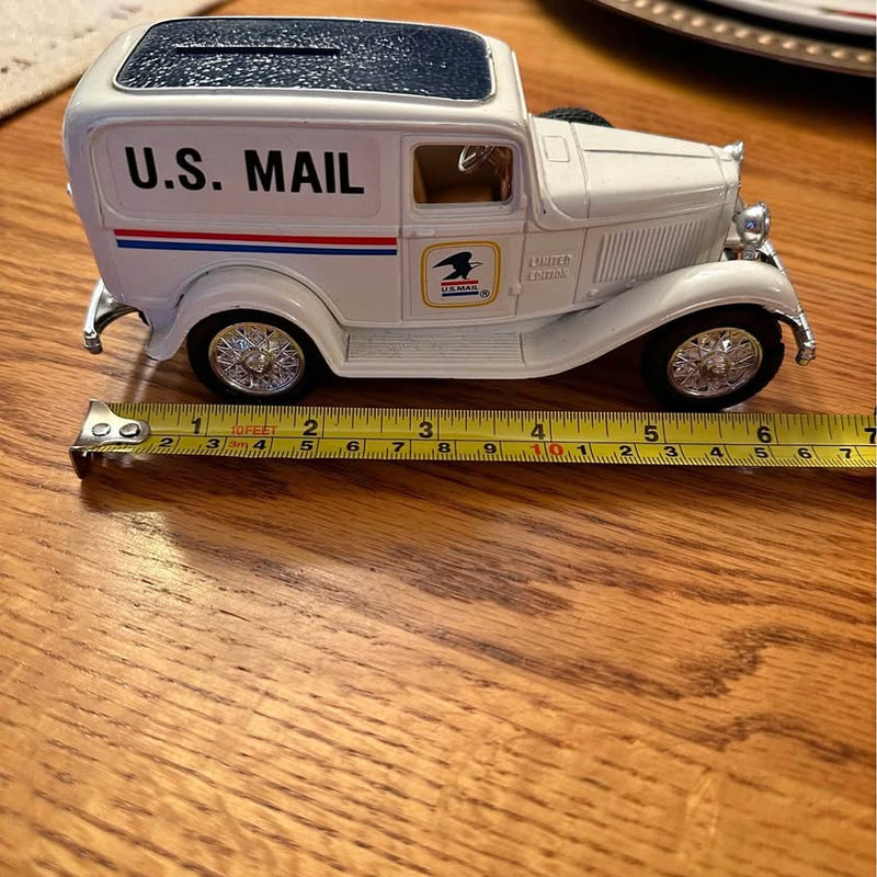 Metal diecast U.S. Mail delivery truck model, white with blue stripe, front view