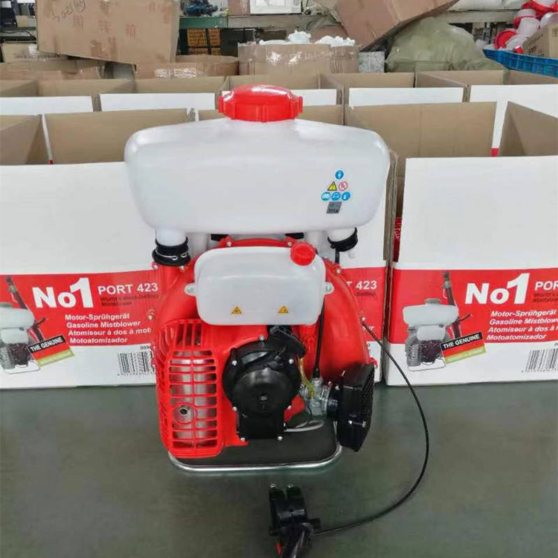 Portable mist sprayer with white tank, red engine housing, black handles and hose