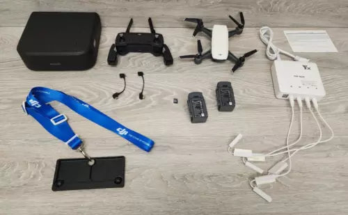 Drone controller and accessory set with batteries, cables, and carrying case