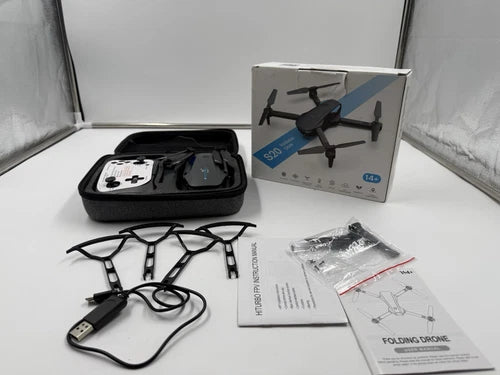 Foldable quadcopter drone kit with remote controller, case, and instruction manuals