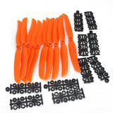 RC airplane propeller set with orange blades and black mounts and screws