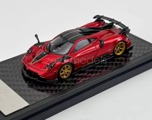 Red sports diecast model car with black detailing, gold wheels, on display base