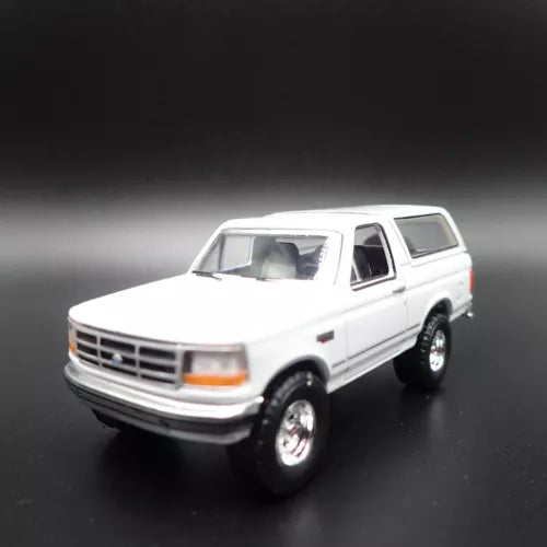 White 1993 Ford Bronco XLT diecast model SUV car, front 3/4 view