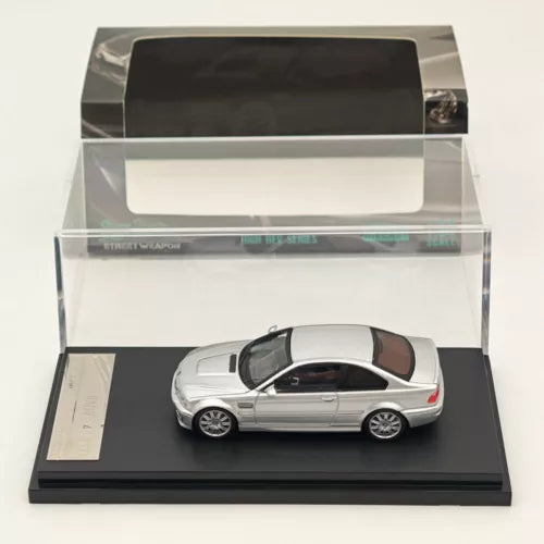Silver diecast model car in display case, white roof, realistic wheels