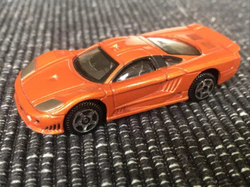 Metallic orange Saleen S1 1:64 diecast car with black hood vents and side stripe