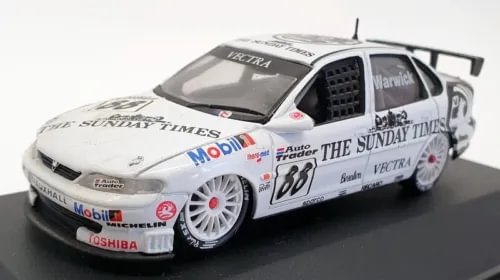 White diecast racing car model with black hood, front 3/4 view, race number 88 decals