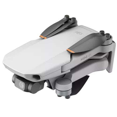 Gray quadcopter drone with camera and four propellers, orange accents on front