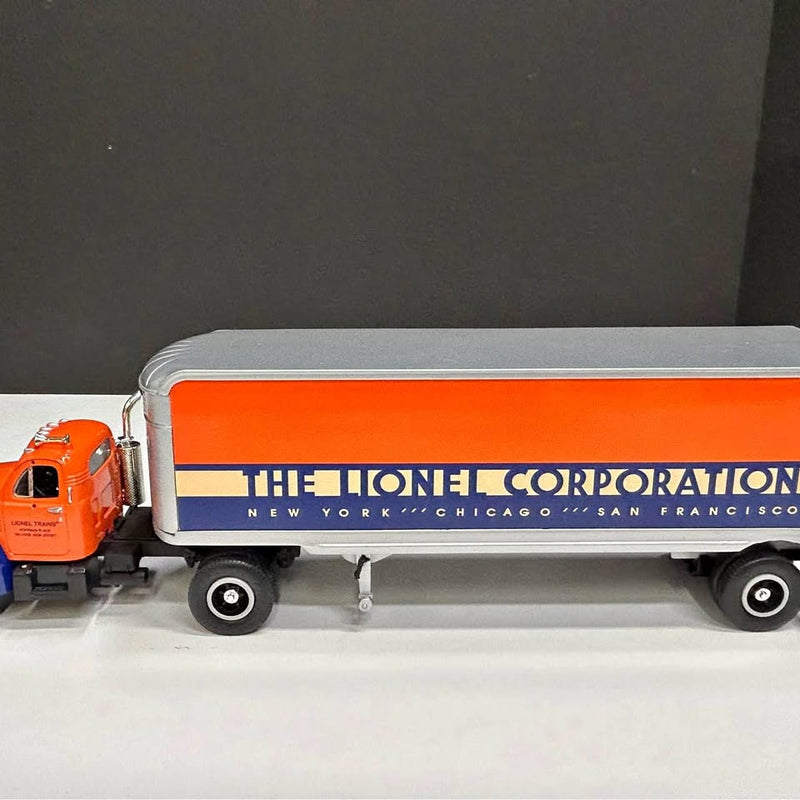 Diecast tractor trailer with orange cab and white box trailer, blue stripe and logo