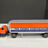 Diecast tractor trailer with orange cab and white box trailer, blue stripe and logo