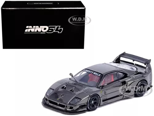 1/64 die-cast model car in dark black, front 3/4 view with open rear wing