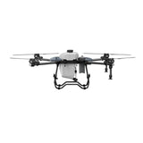 Agricultural spraying drone with quad rotors and front spray tank