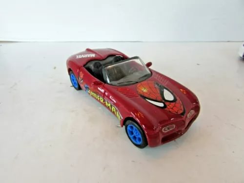 Red diecast toy car with Spider-Man graphic, open-top hood and blue wheels