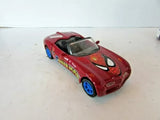 Red diecast toy car with Spider-Man graphic, open-top hood and blue wheels