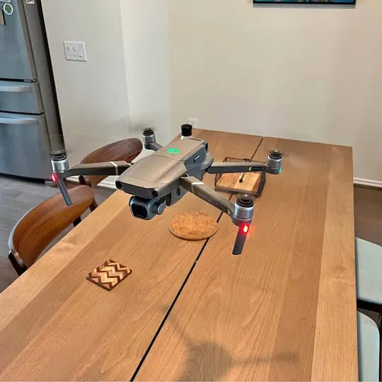 Foldable quadcopter drone with front camera gimbal and four propellers