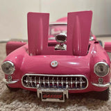 Pink 1957 Corvette gasser diecast car front with chrome grille and headlights