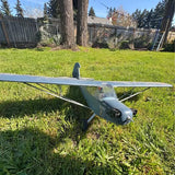 Gray RC airplane model with propeller and two wings