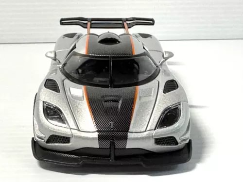 1:32 scale diecast model car, silver body with black grille and orange accents