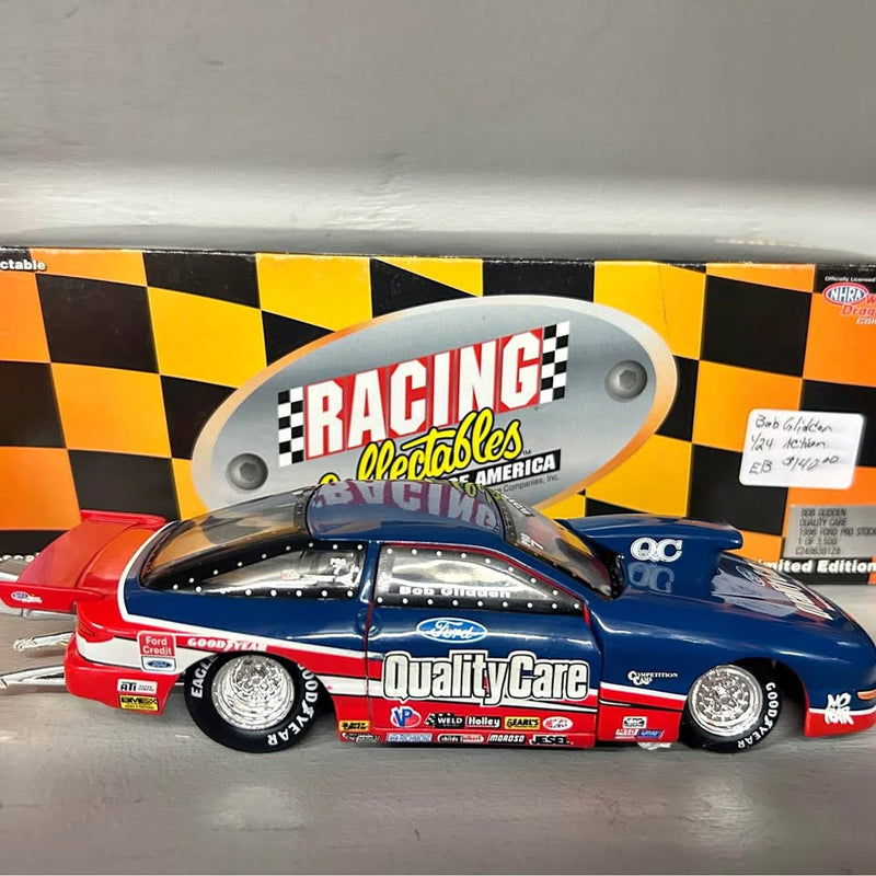 Blue and red NHRA diecast race car model with checkered Racing logo