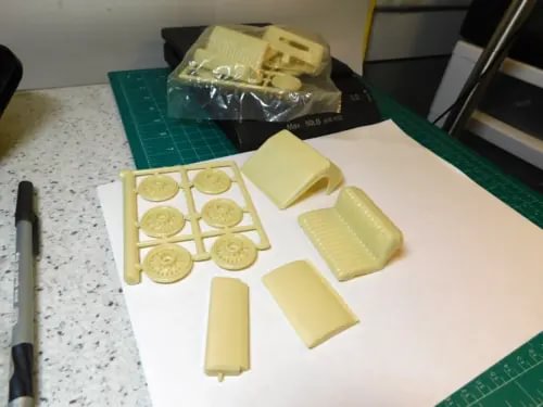Diecast car interior plastic parts set with light yellow seat and trim pieces