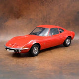 Red 1965 Opel GT diecast sports car model, front 3/4 view