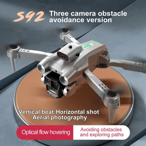 White foldable quadcopter drone with front camera and four spinning propellers