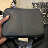 Black zippered drone carrying case with handle and front mesh pocket