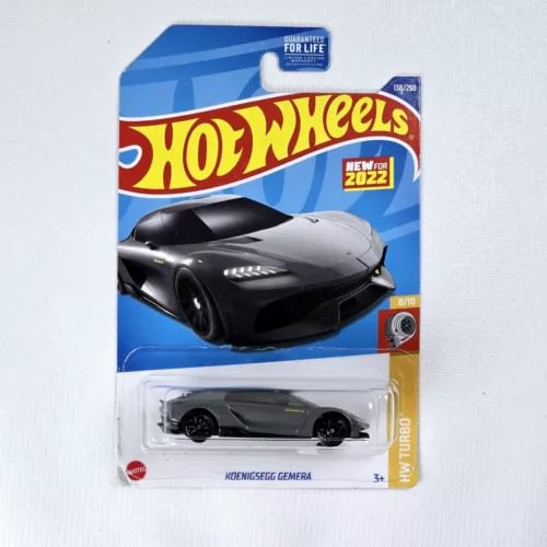 Black diecast sports car on retail card, Hot Wheels styling, front view.