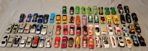 Diecast toy cars and parts assortment, many miniature race cars in mixed colors