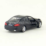 1/36 scale black diecast model car with silver wheels, rear view