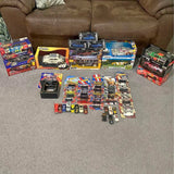 Diecast car and truck lot with multiple boxed models, assorted colors and designs
