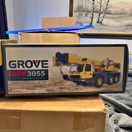 Diecast model toy truck on display in branded retail box, Grove GMK3055