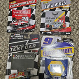 Packaged diecast race car models, including red Craftsman car and blue #9 car