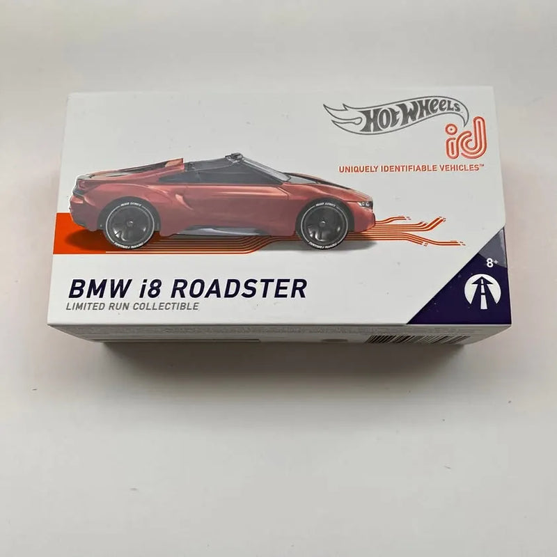 Red and black BMW i8 Roadster Hot Wheels diecast car in retail box