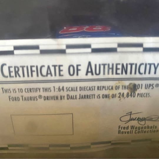 Certificate of authenticity card with Ford Taurus and Dale Jarret signatures