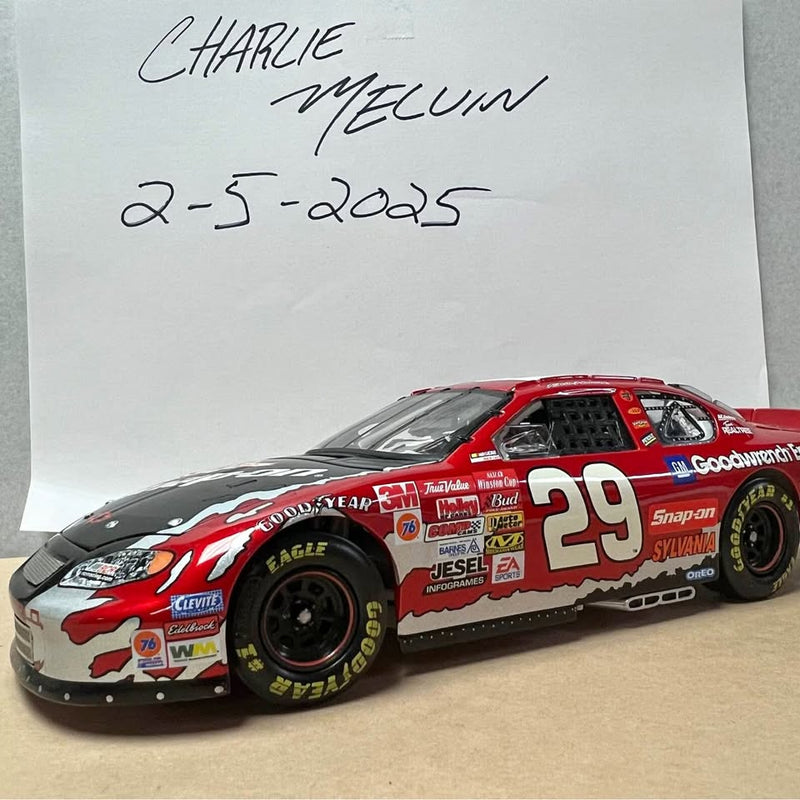 Red and gray diecast race car with number 29 on side and black wheels