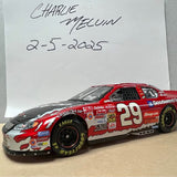 Red and gray diecast race car with number 29 on side and black wheels