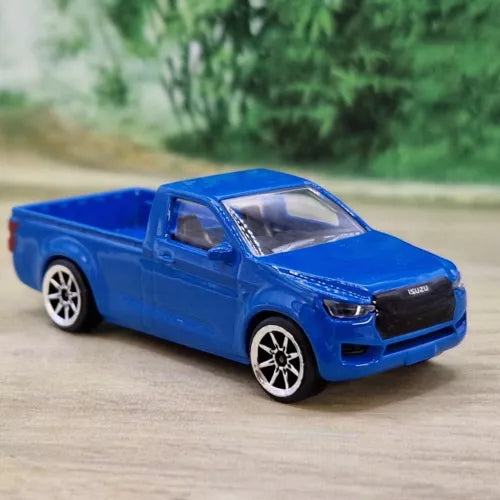 Blue diecast pickup truck model with white spoke wheels and detailed front grille