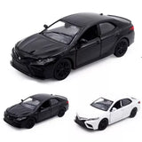 Diecast toy car model in black and white, detailed body with wheels