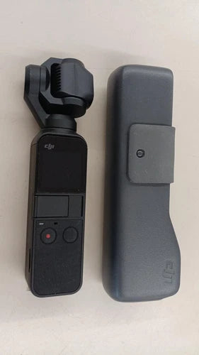 DJI wearable action camera with dark screen and gray strap holder
