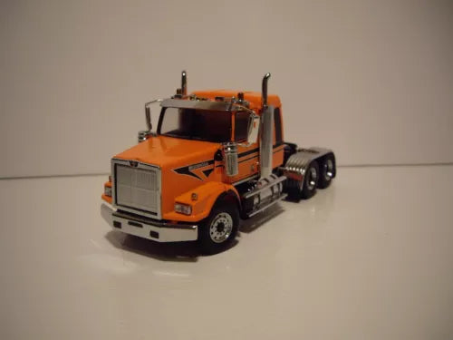 Metallic orange diecast truck model with chrome bumper and detailed cab