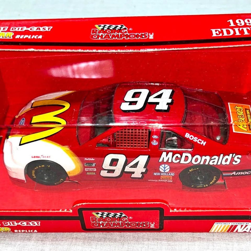 Red #94 diecast race car with McDonald's branding and Racing Champions logo