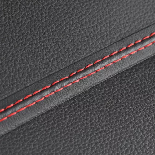 Black leather-like panel with red double-stitched seam