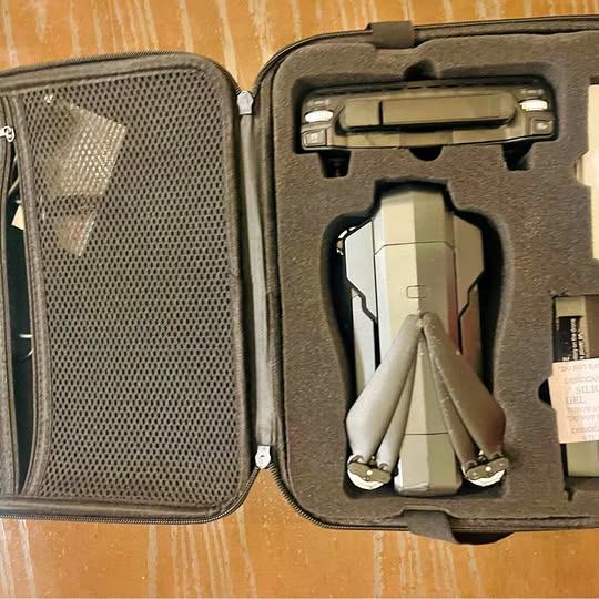 Hard-shell drone carrying case with foam insert and controller mount
