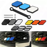 Diecast car model parts set with colored panels, strips, and small hardware pieces
