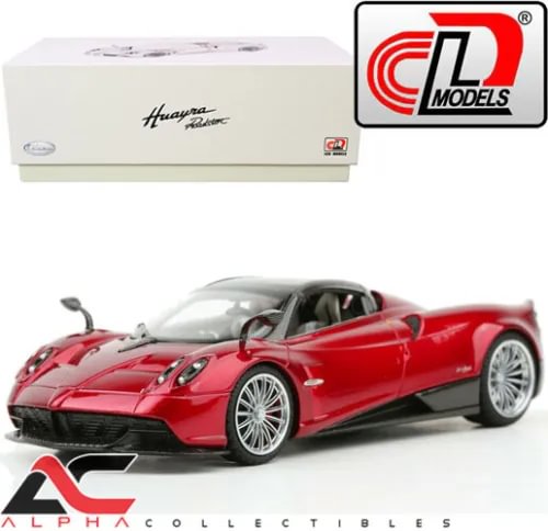 Red Pagani Huayra Roadster diecast model car with silver wheels, front three-quarter view.